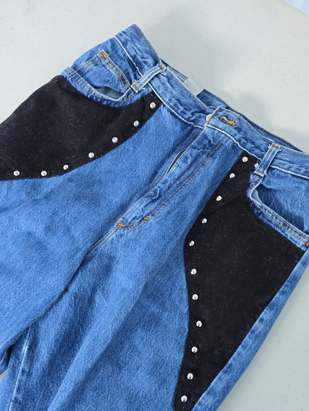Vintage High-Rise Blue Denim Jeans with Black Suede Accents & Studs
